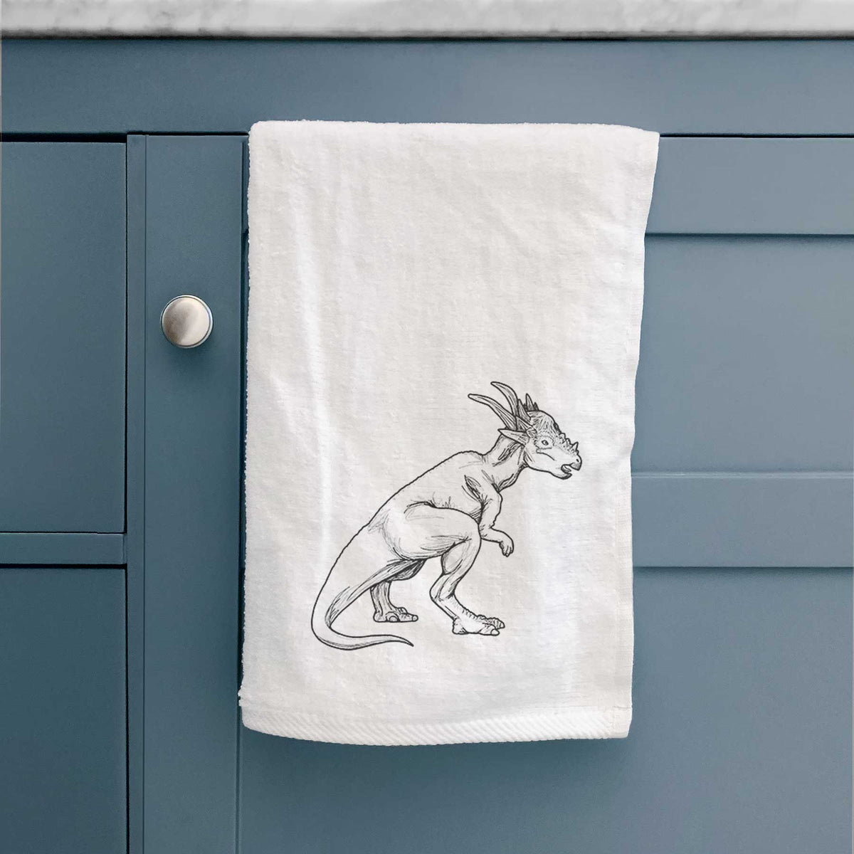 White hand towel printed with a black ink illustration of a Stygimoloch dinosaur with a spiky domed head.