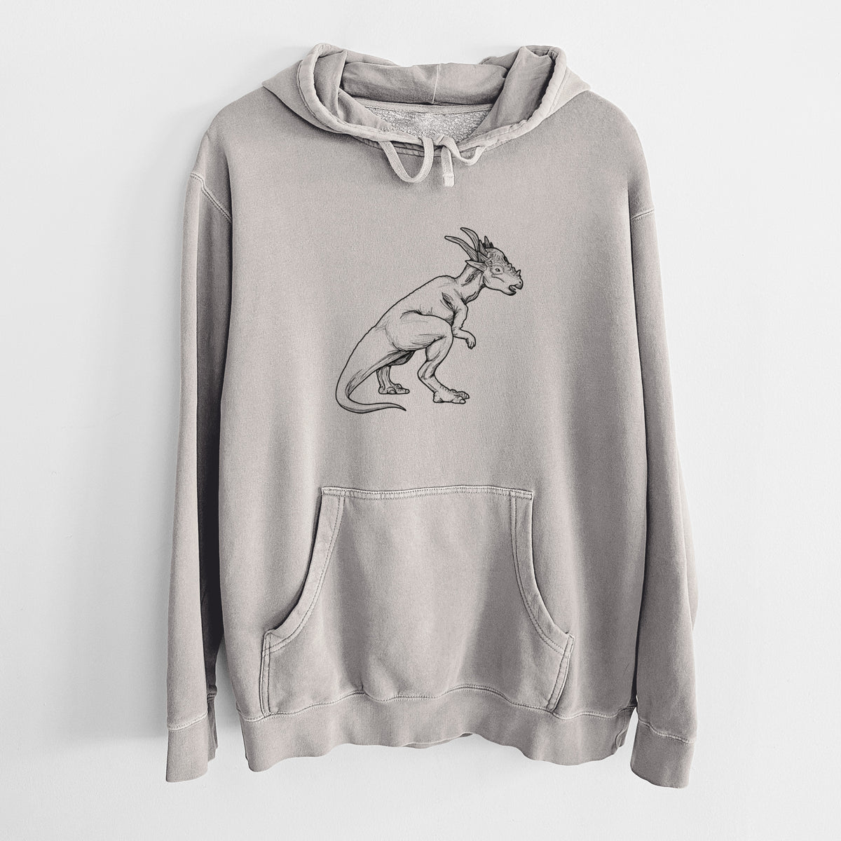 Cement grey pigment dyed hoodie laid flat, printed with a black ink illustration of a Stygimoloch dinosaur with a spiky domed head.