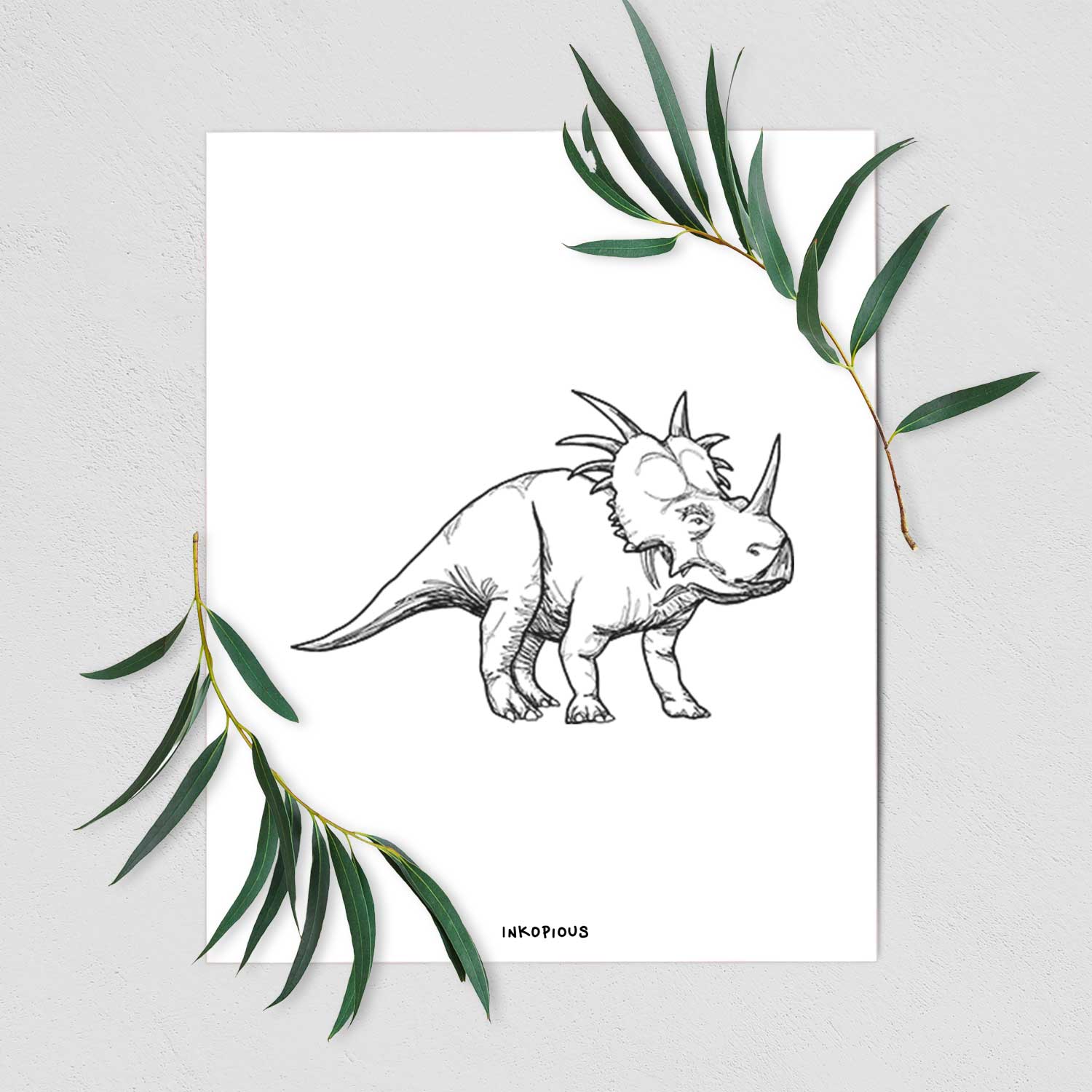 Art print of a black ink illustration of a Styracosaurus with its spiked frill, shown with eucalyptus leaves.