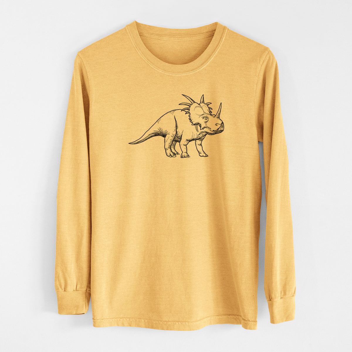 Golden wheat yellow Comfort Colors long sleeve shirt laid flat, printed with a black ink illustration of a Styracosaurus with its spiked frill.