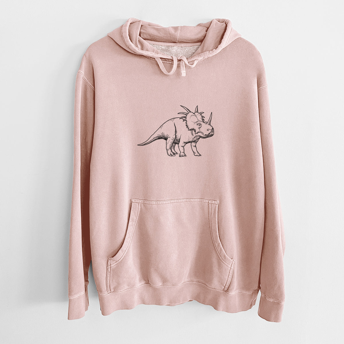 Dusty pink pigment dyed hoodie laid flat, printed with a black ink illustration of a Styracosaurus with its spiked frill.