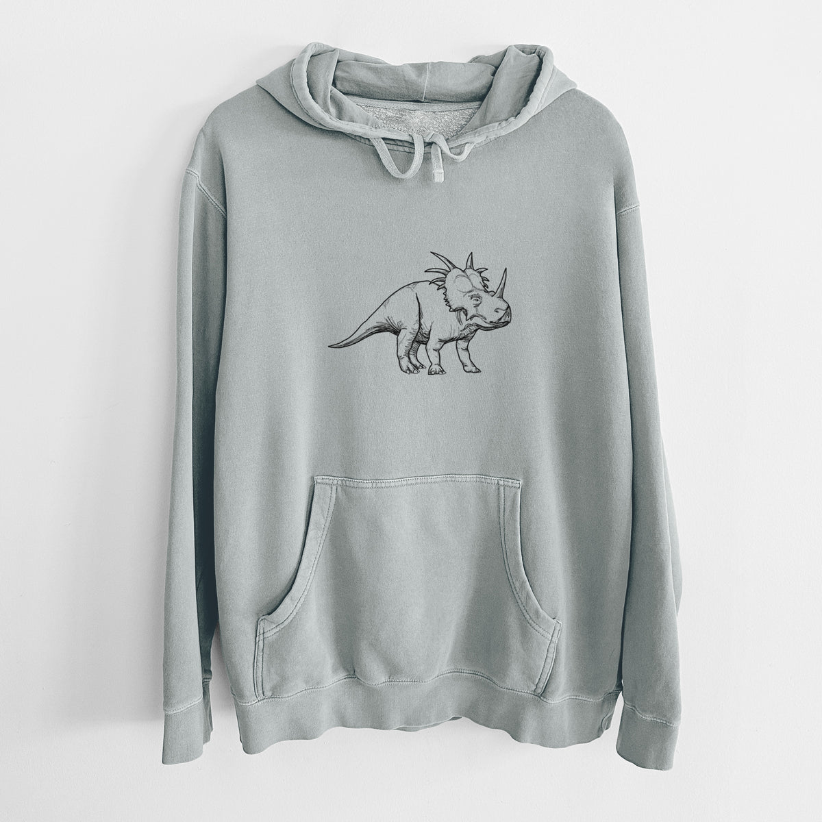 Sage green pigment dyed hoodie laid flat, printed with a black ink illustration of a Styracosaurus with its spiked frill.