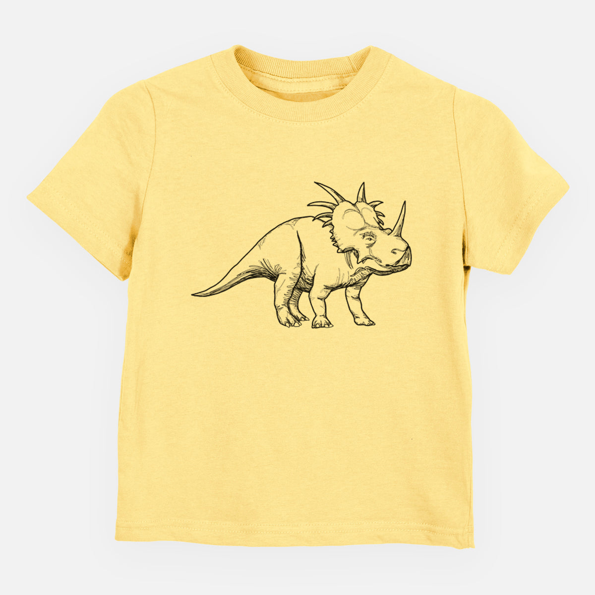 Butter yellow toddler t-shirt laid flat, printed with a black ink illustration of a Styracosaurus with its spiked frill.