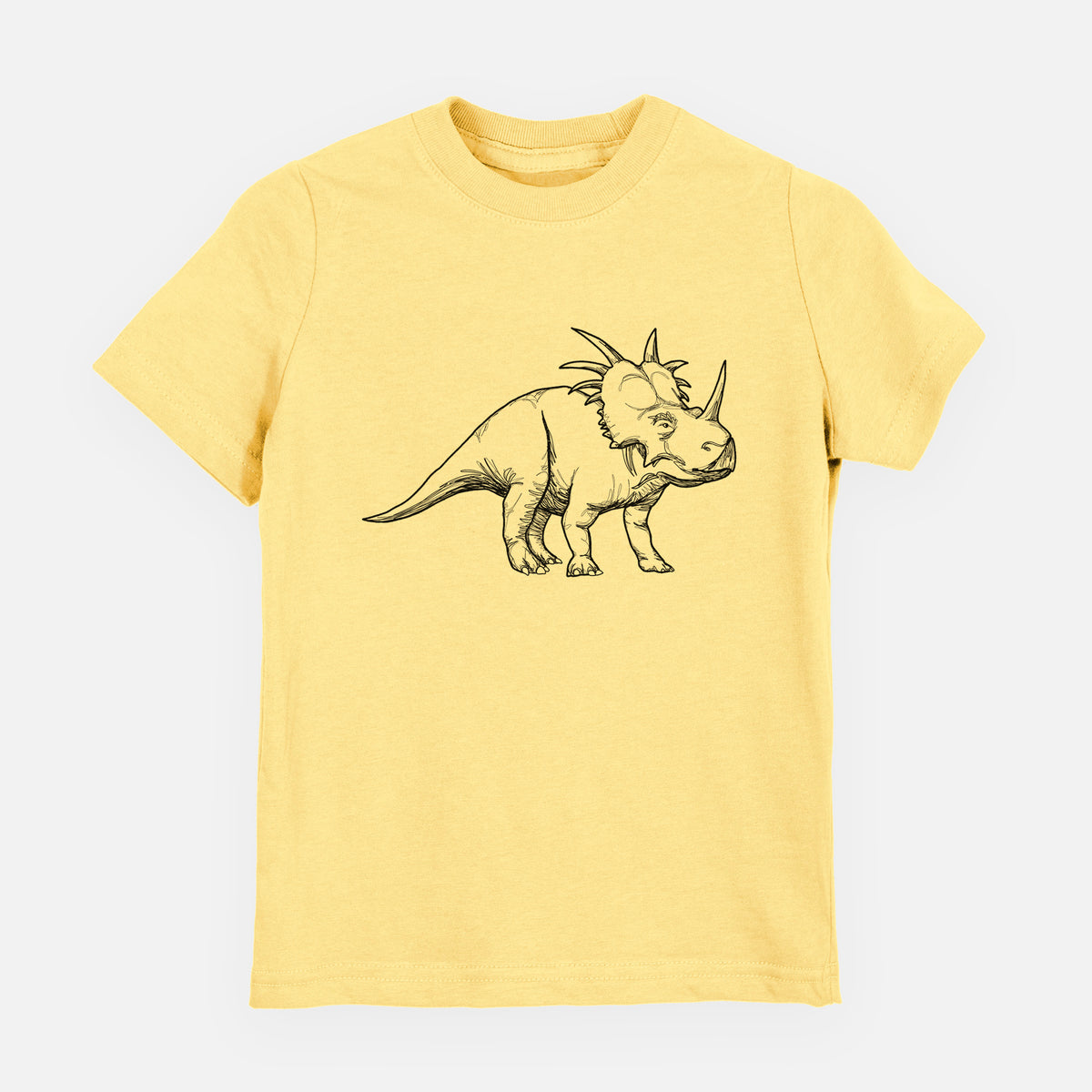 Butter yellow youth t-shirt laid flat, printed with a black ink illustration of a Styracosaurus with its spiked frill.