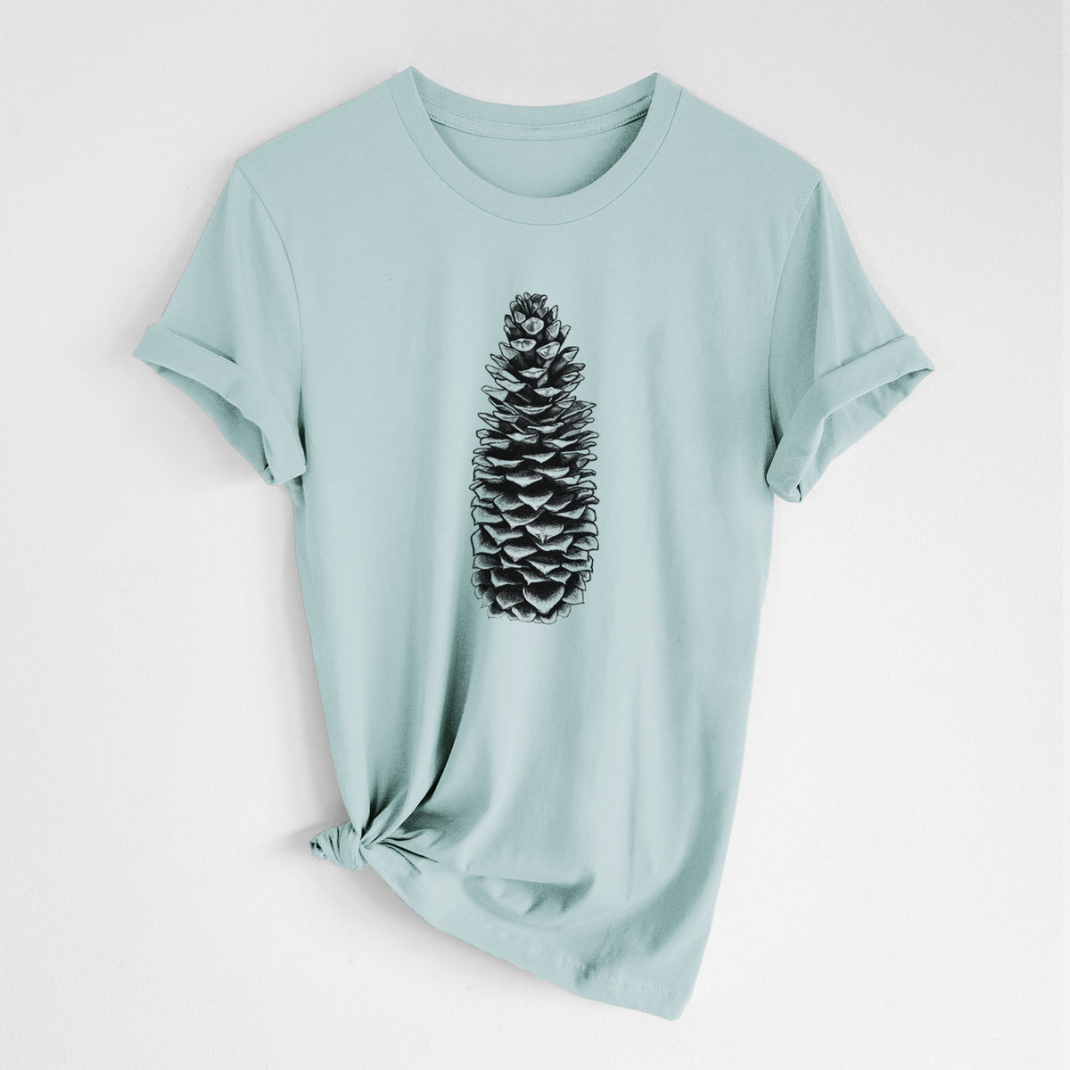 Dusty blue lightweight cotton t-shirt laid flat with the sleeves rolled, printed with a detailed black ink illustration of a long sugar pine cone.