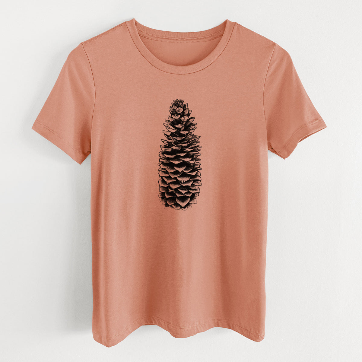 Terracotta orange women's relaxed fit cotton t-shirt laid flat, printed with a detailed black ink illustration of a long sugar pine cone.