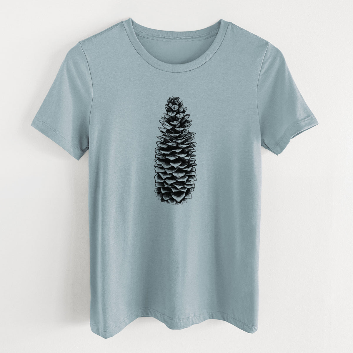 Vintage denim women's relaxed fit cotton t-shirt laid flat, printed with a detailed black ink illustration of a long sugar pine cone.
