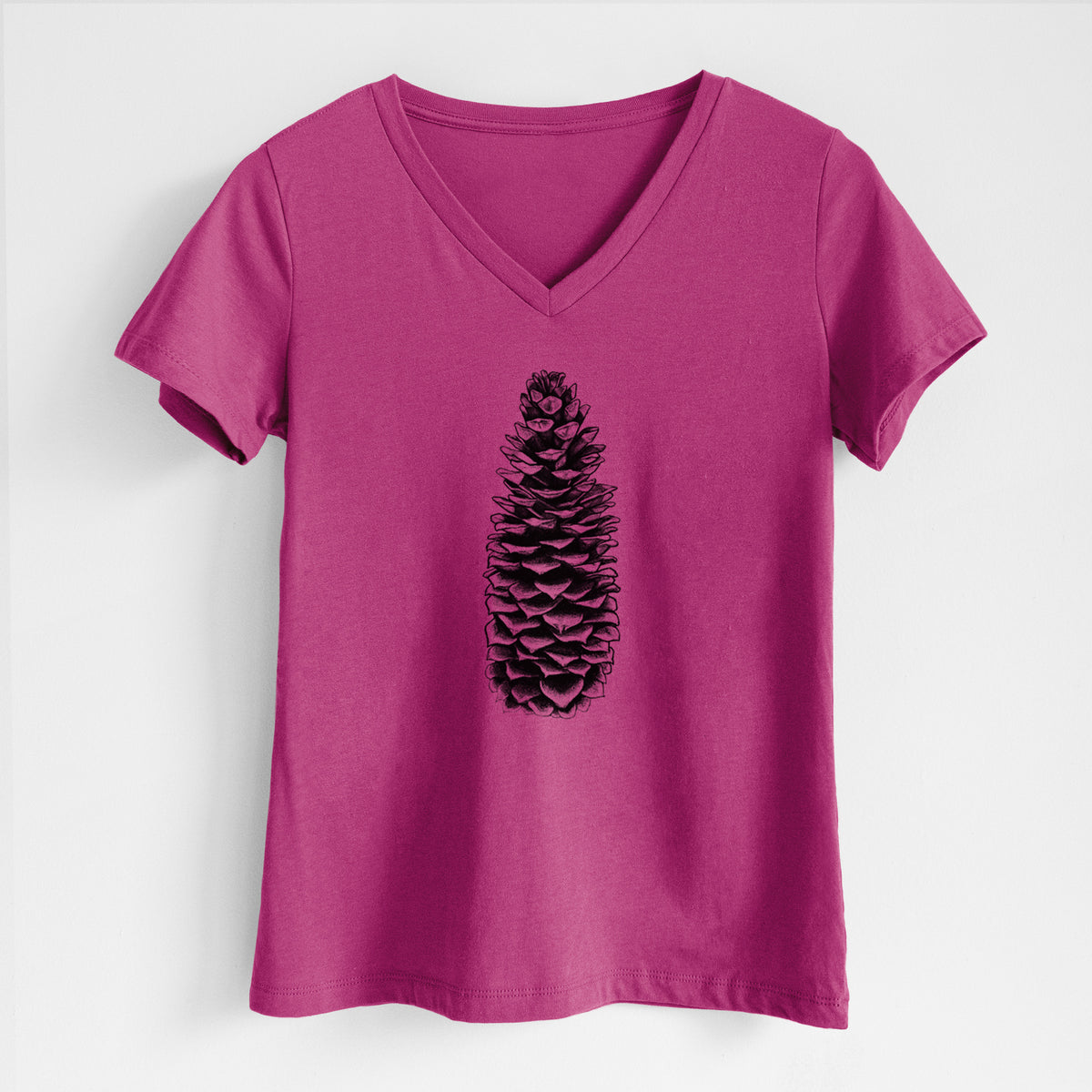 Berry pink women's relaxed fit cotton V-neck t-shirt laid flat, printed with a detailed black ink illustration of a long sugar pine cone.