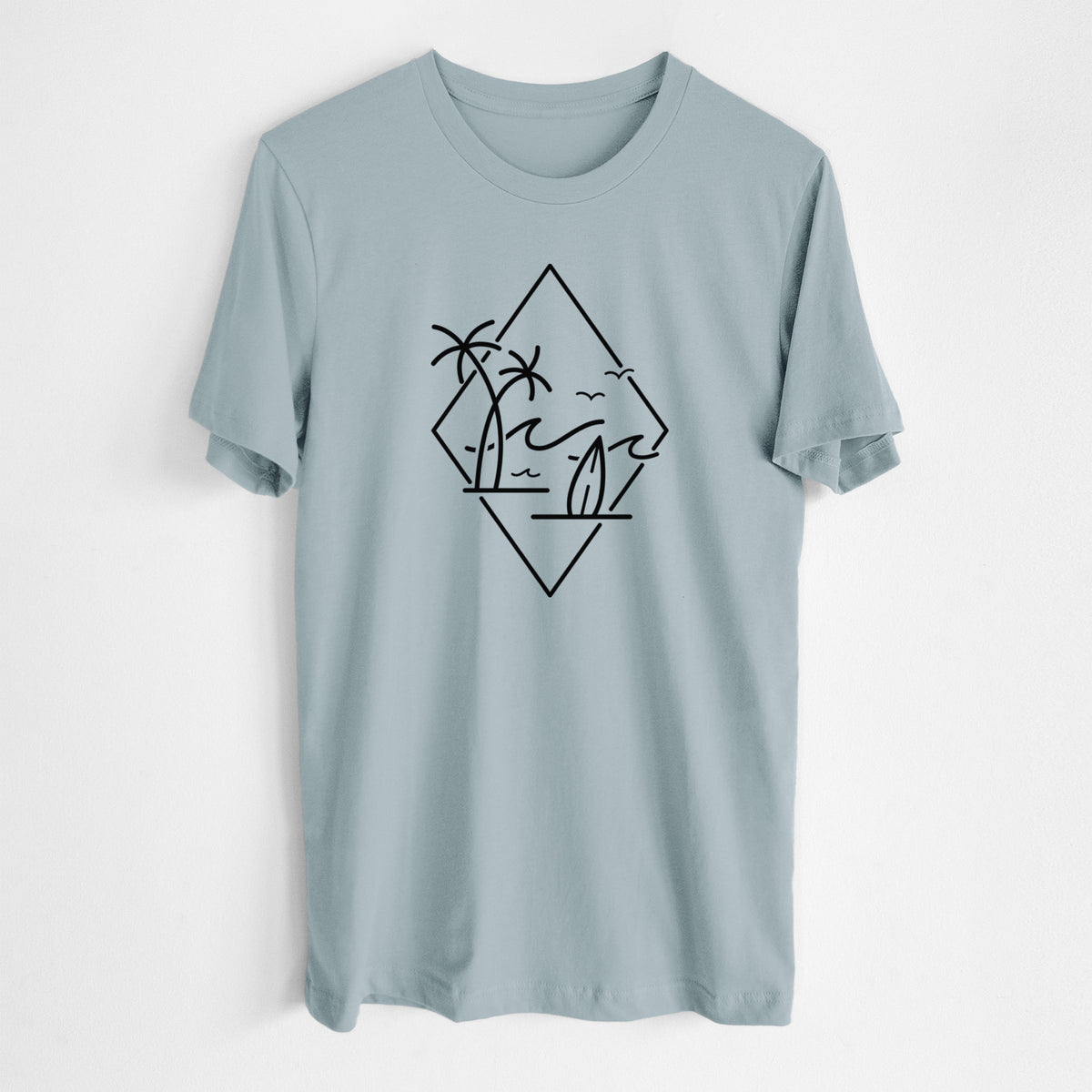 Vintage denim lightweight cotton t-shirt laid flat, printed with black line art of palm trees, ocean waves, birds and a surfboard inside a diamond outline.