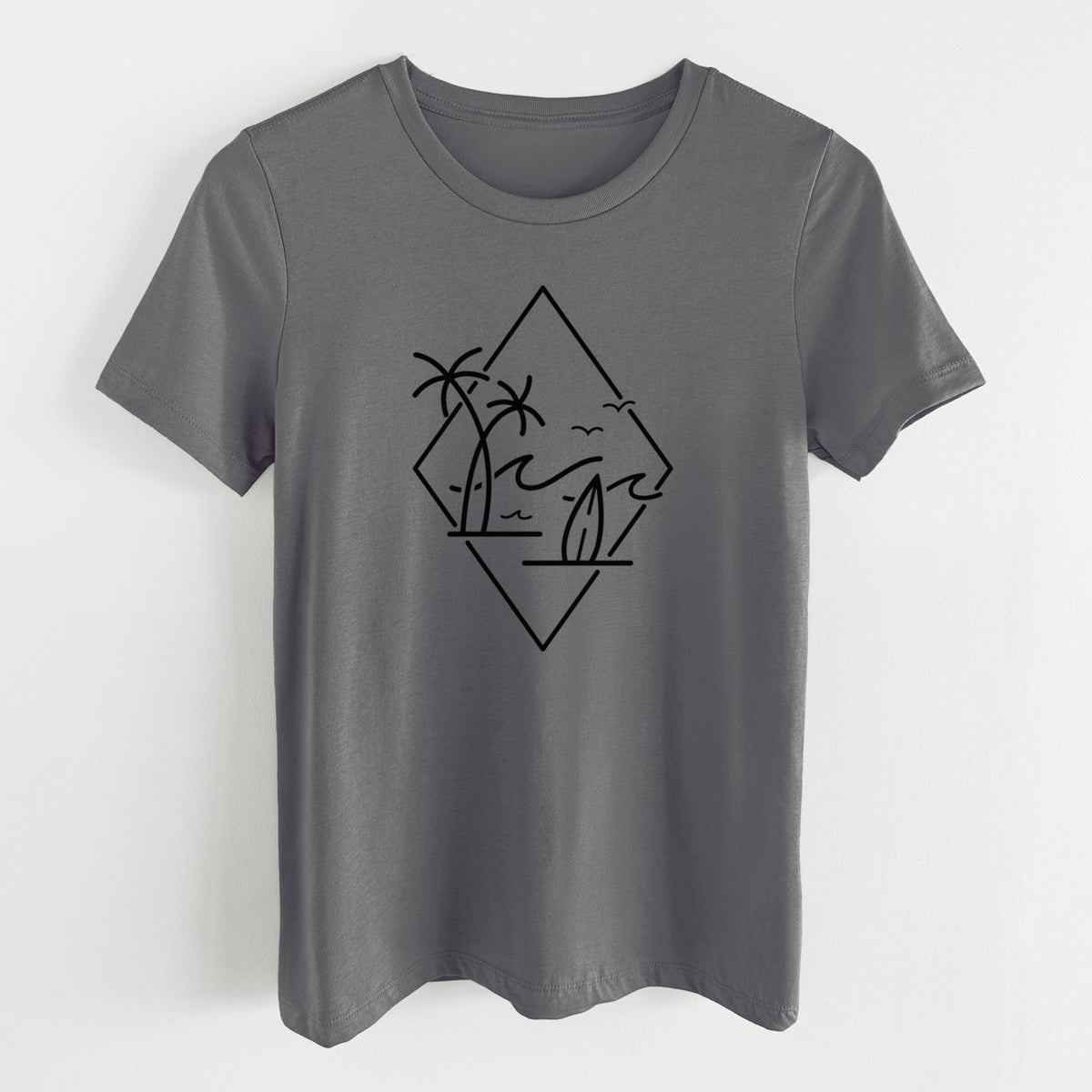 Asphalt women's relaxed fit cotton t-shirt laid flat, printed with black line art of palm trees, ocean waves, birds and a surfboard inside a diamond outline.