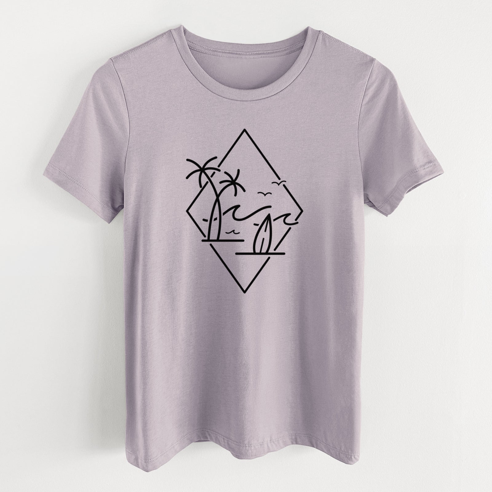 Light violet women's relaxed fit cotton t-shirt laid flat, printed with black line art of palm trees, ocean waves, birds and a surfboard inside a diamond outline.