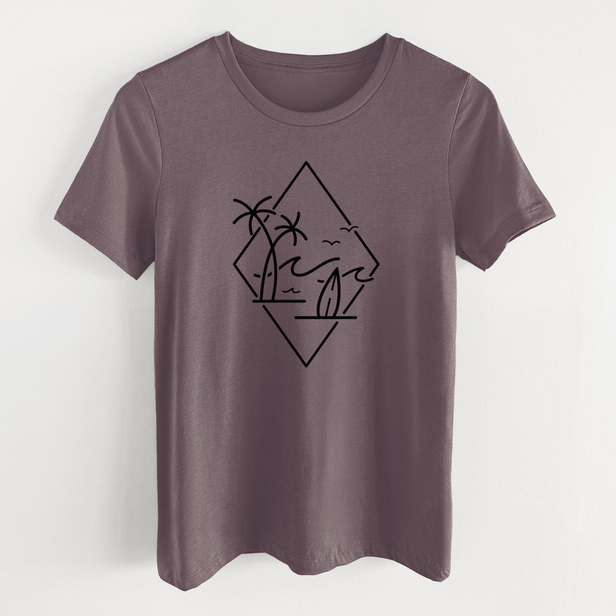 Purple storm women's relaxed fit cotton t-shirt laid flat, printed with black line art of palm trees, ocean waves, birds and a surfboard inside a diamond outline.