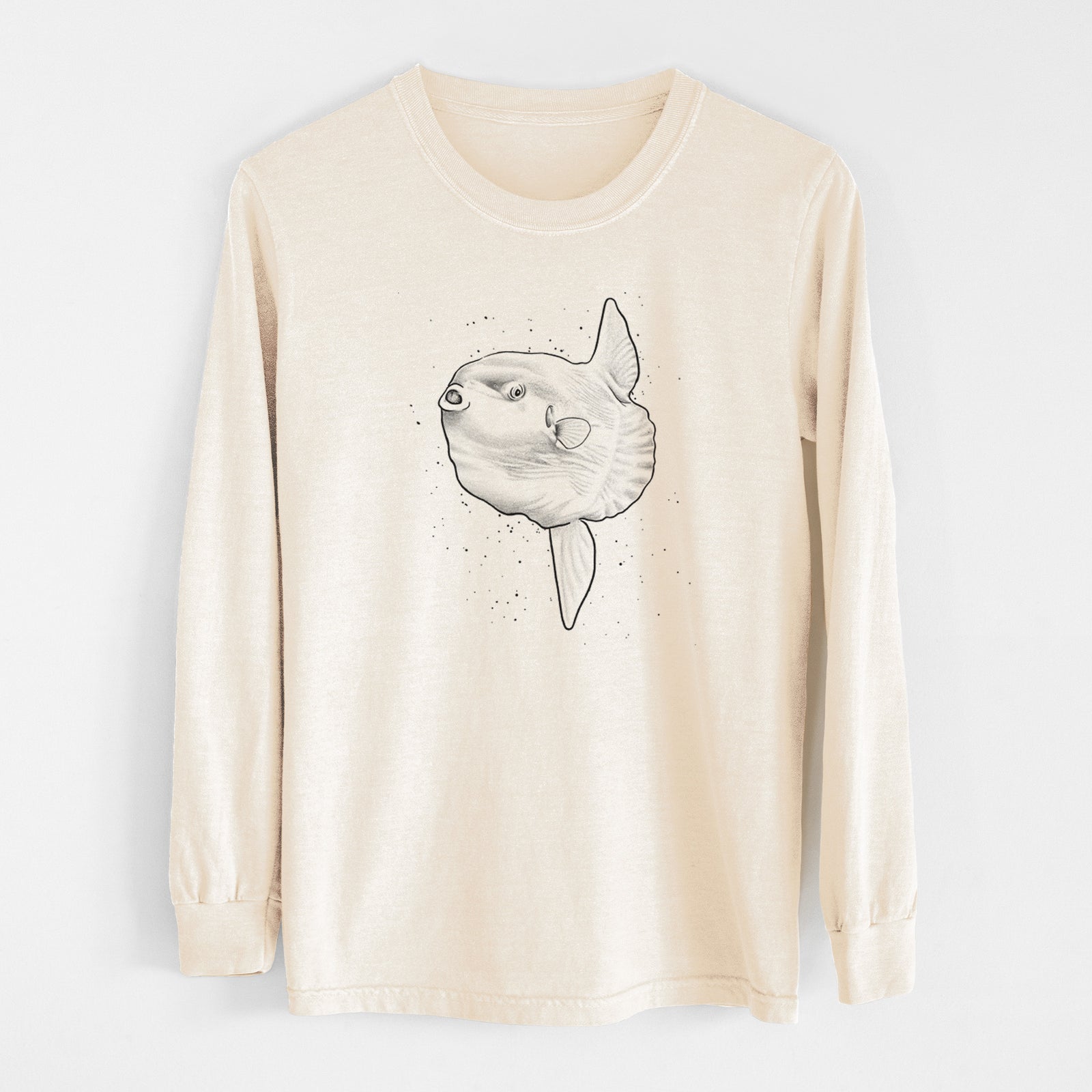 Ivory Comfort Colors long sleeve shirt laid flat, printed with a black ink illustration of an ocean sunfish swimming.