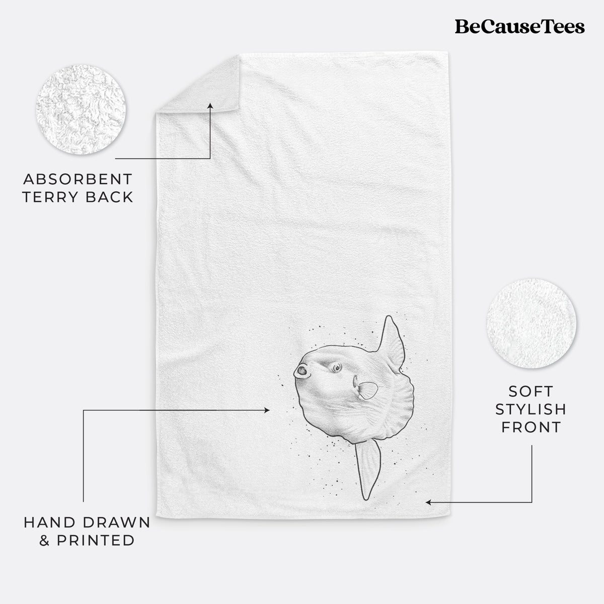 White hand towel printed with a black ink illustration of an ocean sunfish swimming.