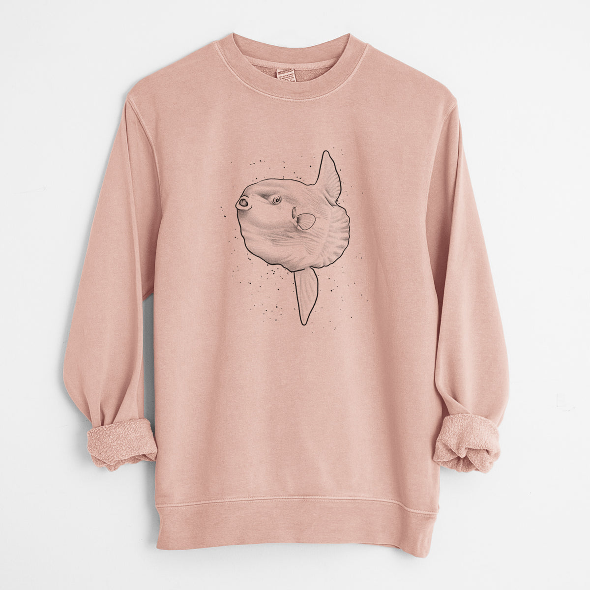 Dusty pink pigment dyed crewneck sweatshirt laid flat with the sleeves rolled, printed with a black ink illustration of an ocean sunfish swimming.