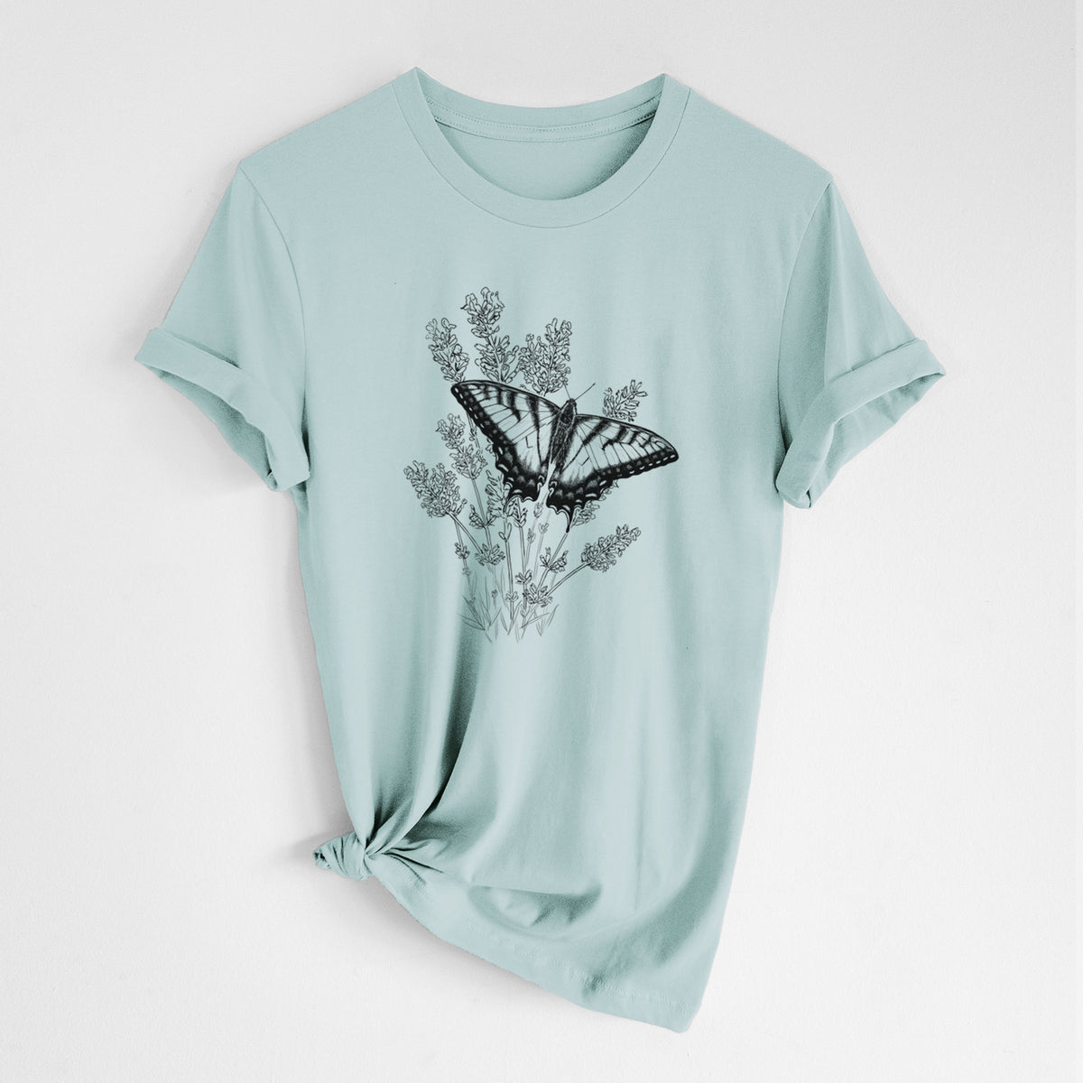 Dusty blue lightweight cotton t-shirt laid flat with the sleeves rolled, printed with a black ink illustration of a swallowtail butterfly resting on lavender.