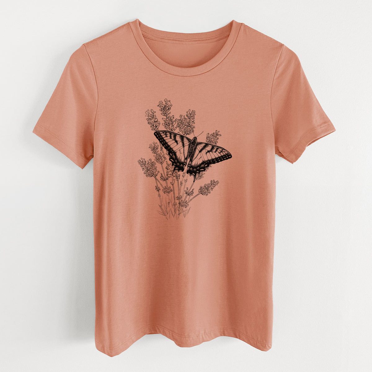 Terracotta orange women's relaxed fit cotton t-shirt laid flat, printed with a black ink illustration of a swallowtail butterfly resting on lavender.