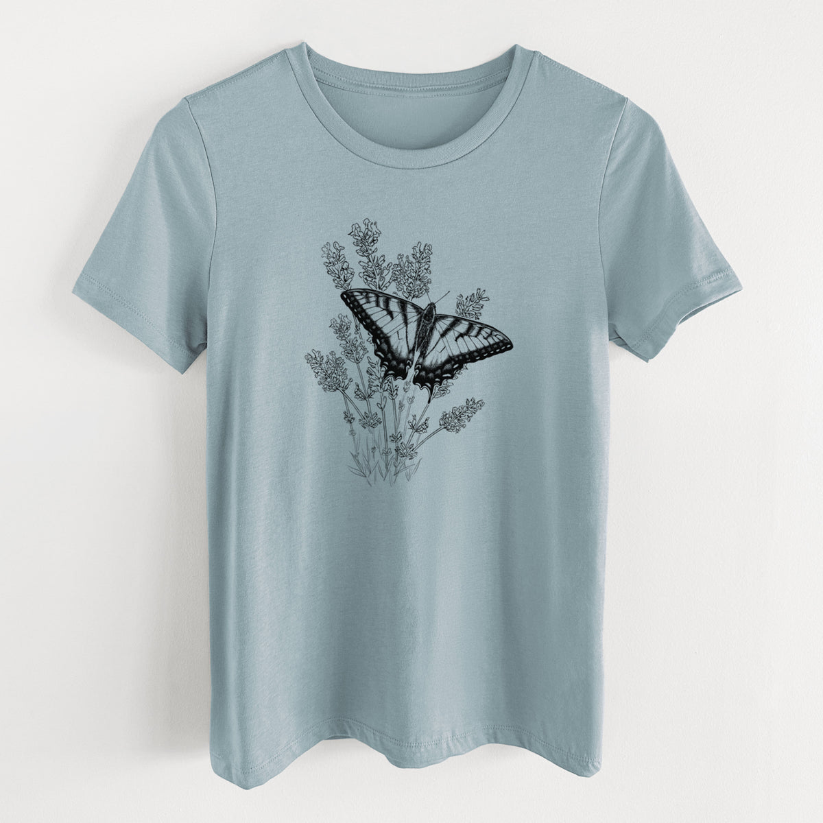 Vintage denim women's relaxed fit cotton t-shirt laid flat, printed with a black ink illustration of a swallowtail butterfly resting on lavender.