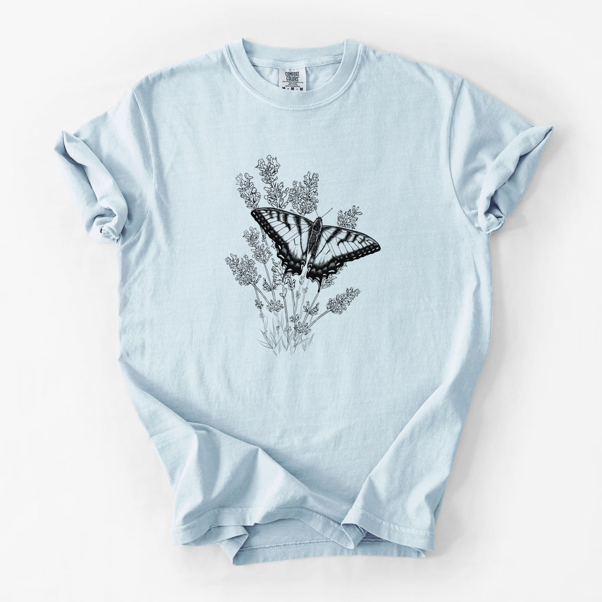 Chambray blue Comfort Colors t-shirt laid flat, printed with a black ink illustration of a swallowtail butterfly resting on lavender.