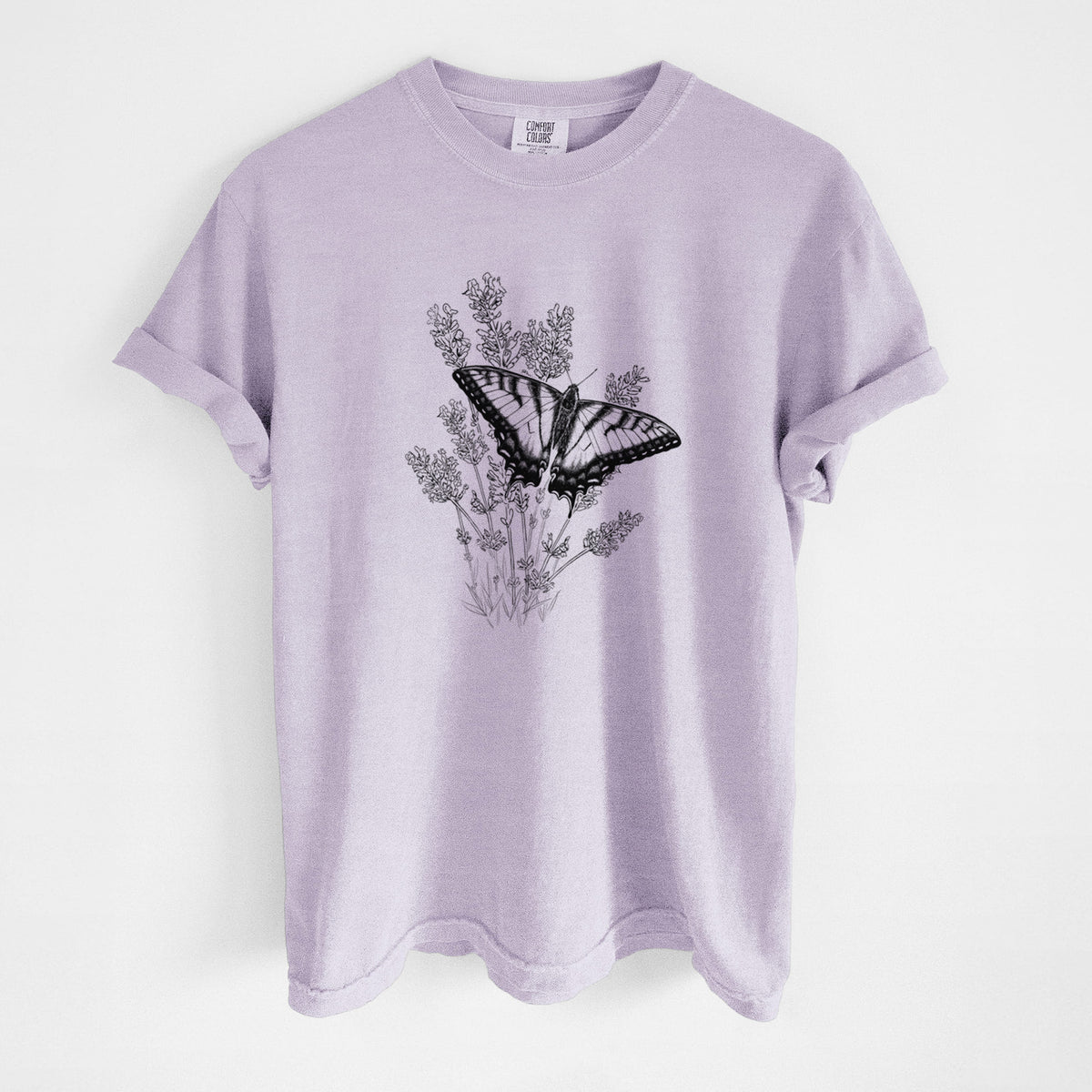 Orchid purple Comfort Colors t-shirt laid flat, printed with a black ink illustration of a swallowtail butterfly resting on lavender.