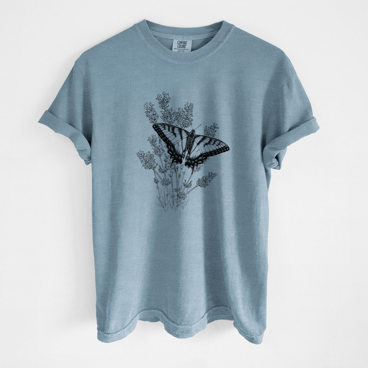 Steel blue Comfort Colors t-shirt laid flat, printed with a black ink illustration of a swallowtail butterfly resting on lavender.