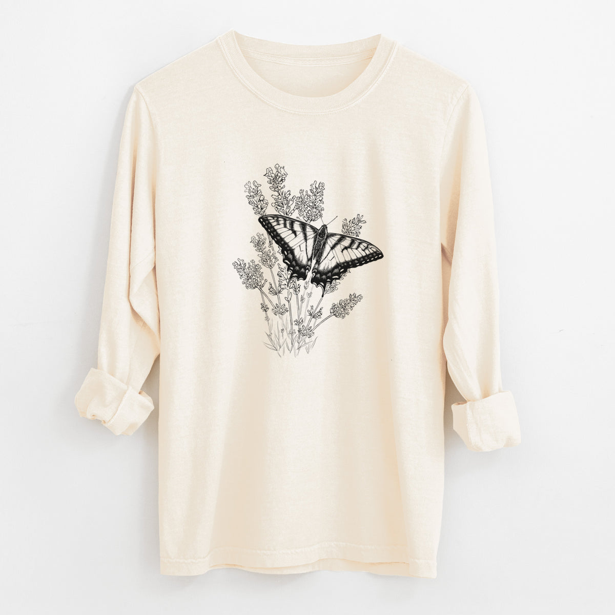 Ivory Comfort Colors long sleeve shirt laid flat with the cuffs rolled, printed with a black ink illustration of a swallowtail butterfly resting on lavender.