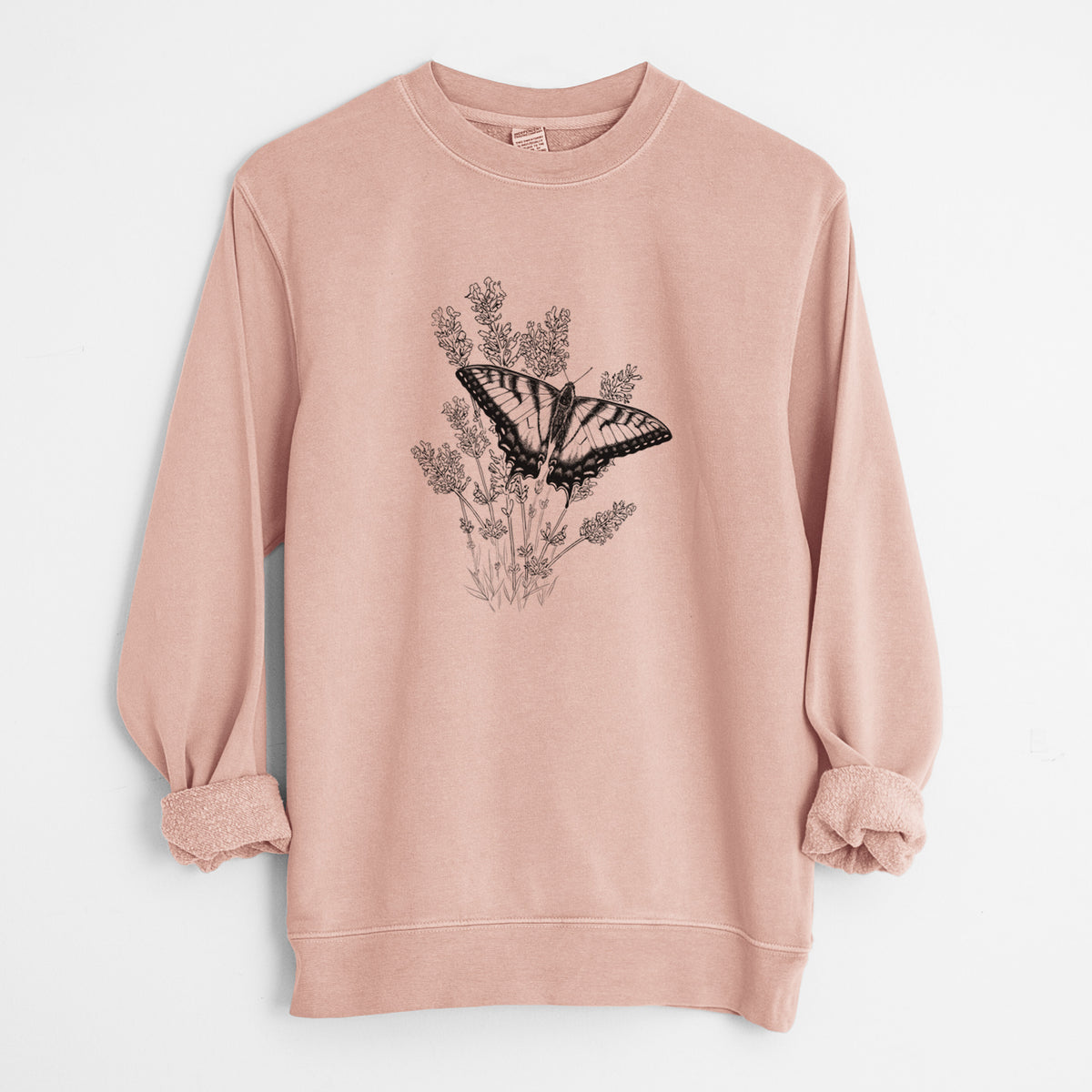 Dusty pink pigment dyed crewneck sweatshirt laid flat with the sleeves rolled, printed with a black ink illustration of a swallowtail butterfly resting on lavender.