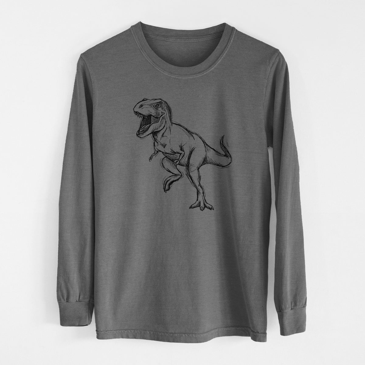 Pepper Comfort Colors long sleeve shirt laid flat, printed with a black ink illustration of a Tyrannosaurus rex roaring.