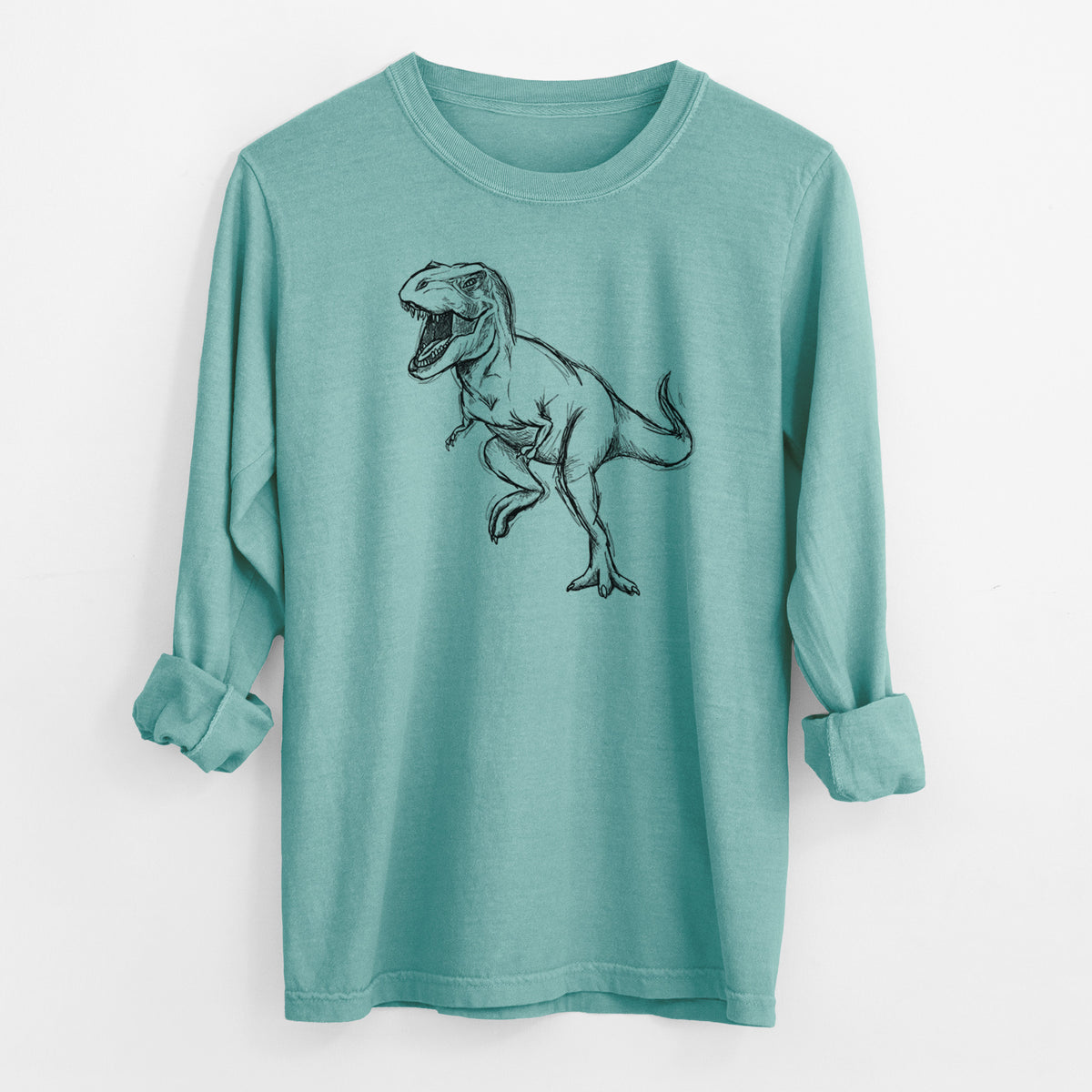 Reef green Comfort Colors long sleeve shirt laid flat with the cuffs rolled, printed with a black ink illustration of a Tyrannosaurus rex roaring.
