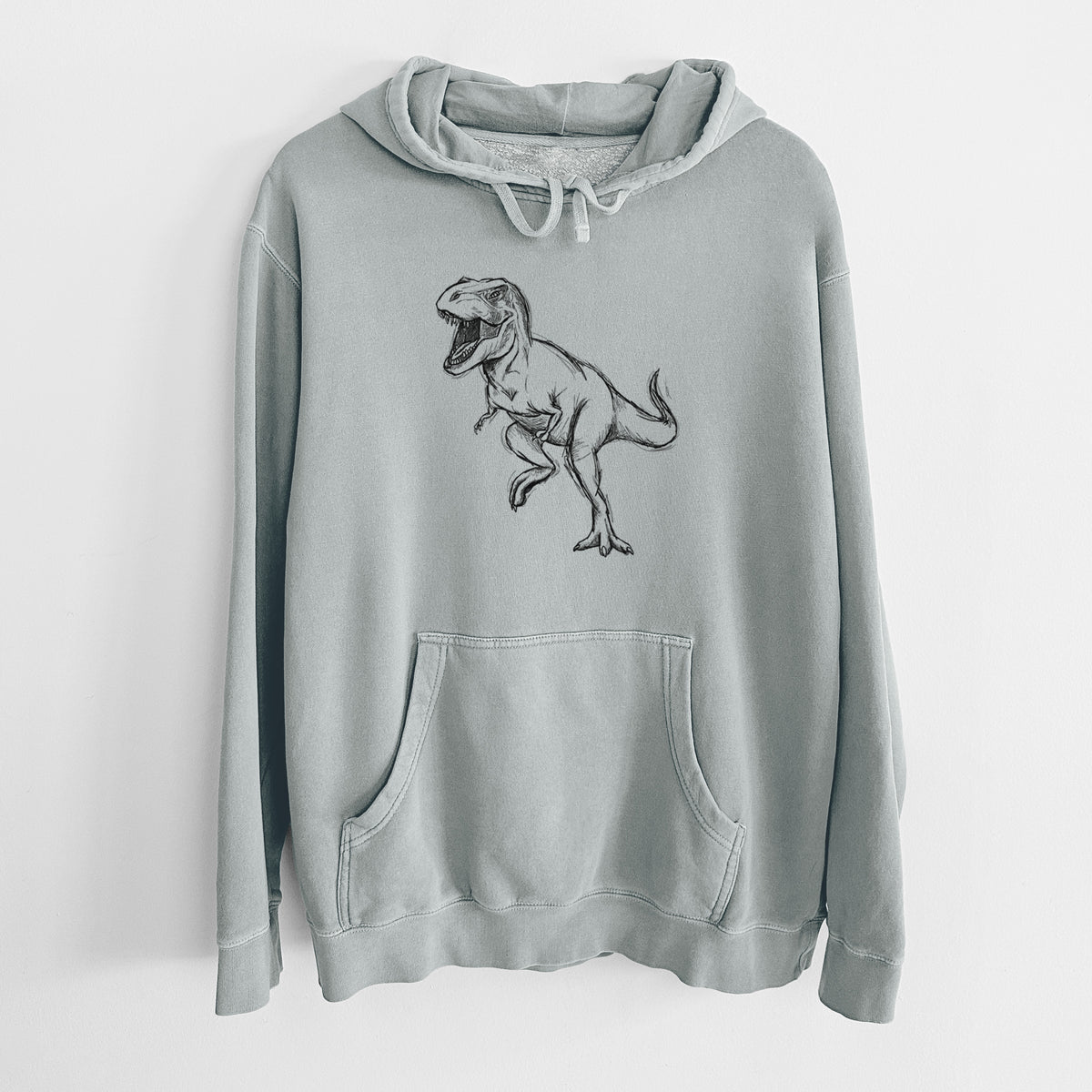 Sage green pigment dyed hoodie laid flat, printed with a black ink illustration of a Tyrannosaurus rex roaring.