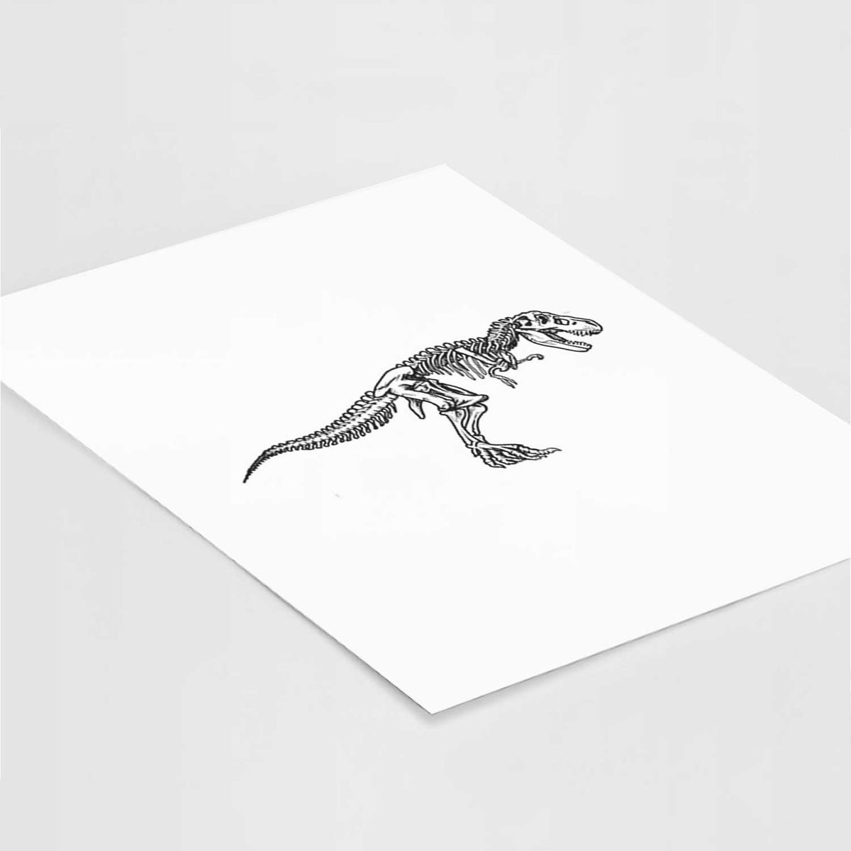 Art print of a black ink illustration of a Tyrannosaurus rex skeleton, lying at an angle on a white surface.