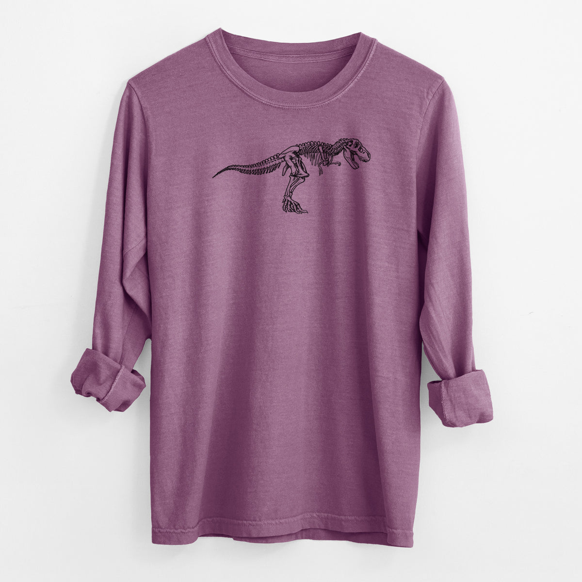 Berry pink Comfort Colors long sleeve shirt laid flat with the cuffs rolled, printed with a black ink illustration of a Tyrannosaurus rex skeleton.