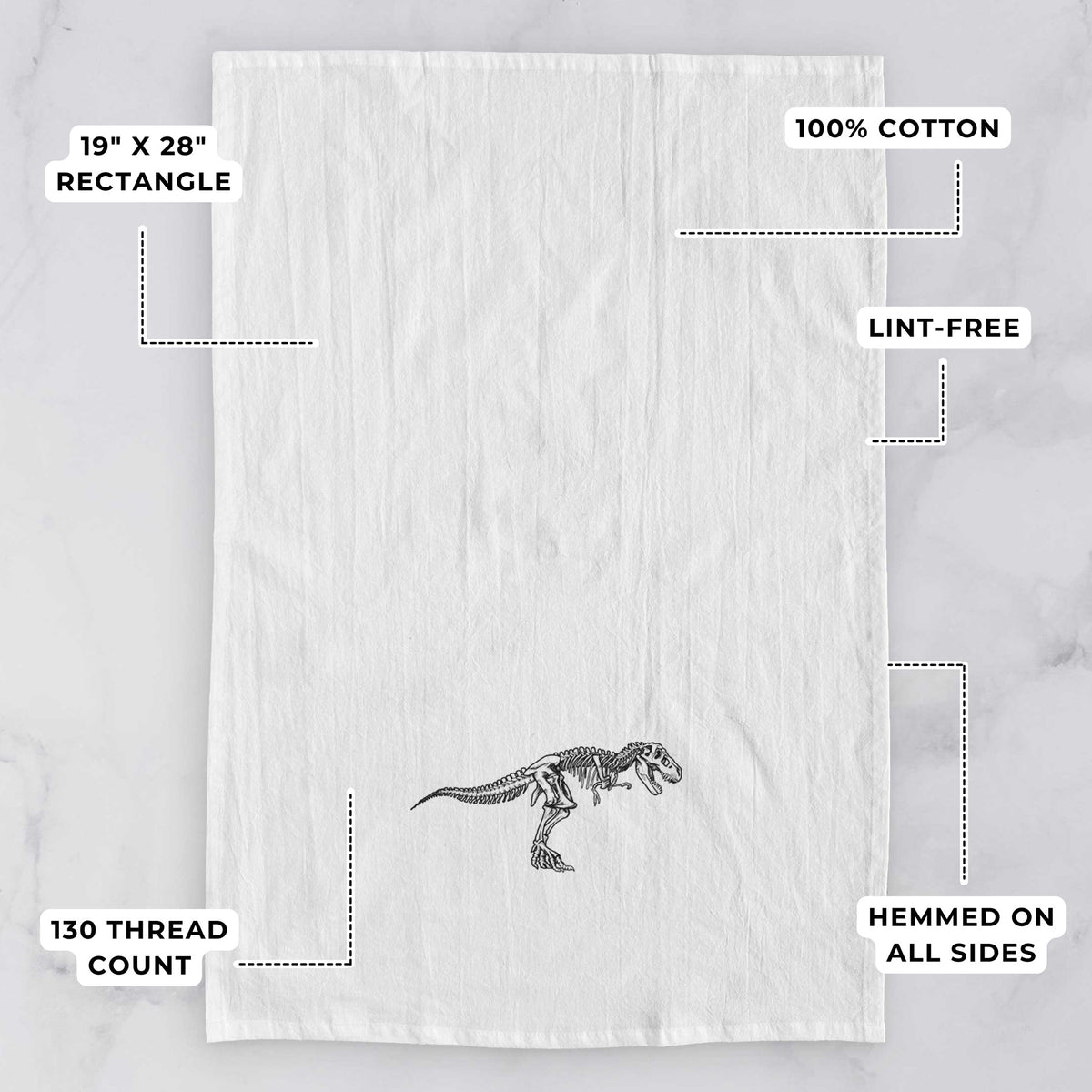 White tea towel printed with a black ink illustration of a Tyrannosaurus rex skeleton, with feature labels: 19 by 28 inch rectangle, 100% cotton, lint-free, 130 thread count, hemmed on all sides.