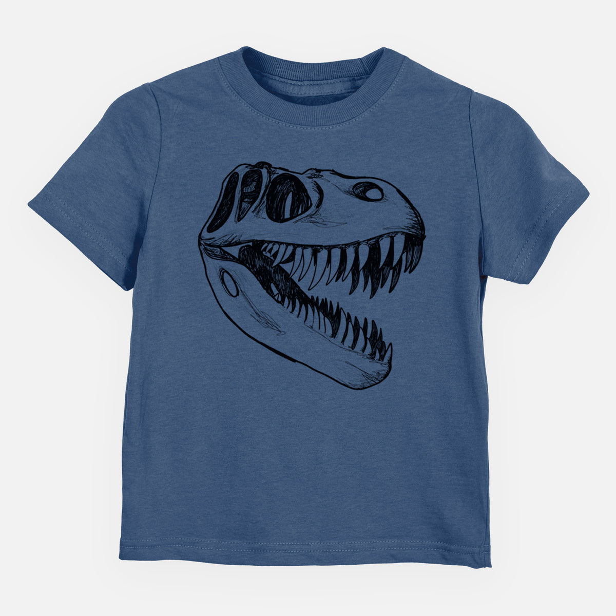 Indigo blue toddler t-shirt laid flat, printed with a black ink illustration of a Tyrannosaurus rex skull with sharp teeth.