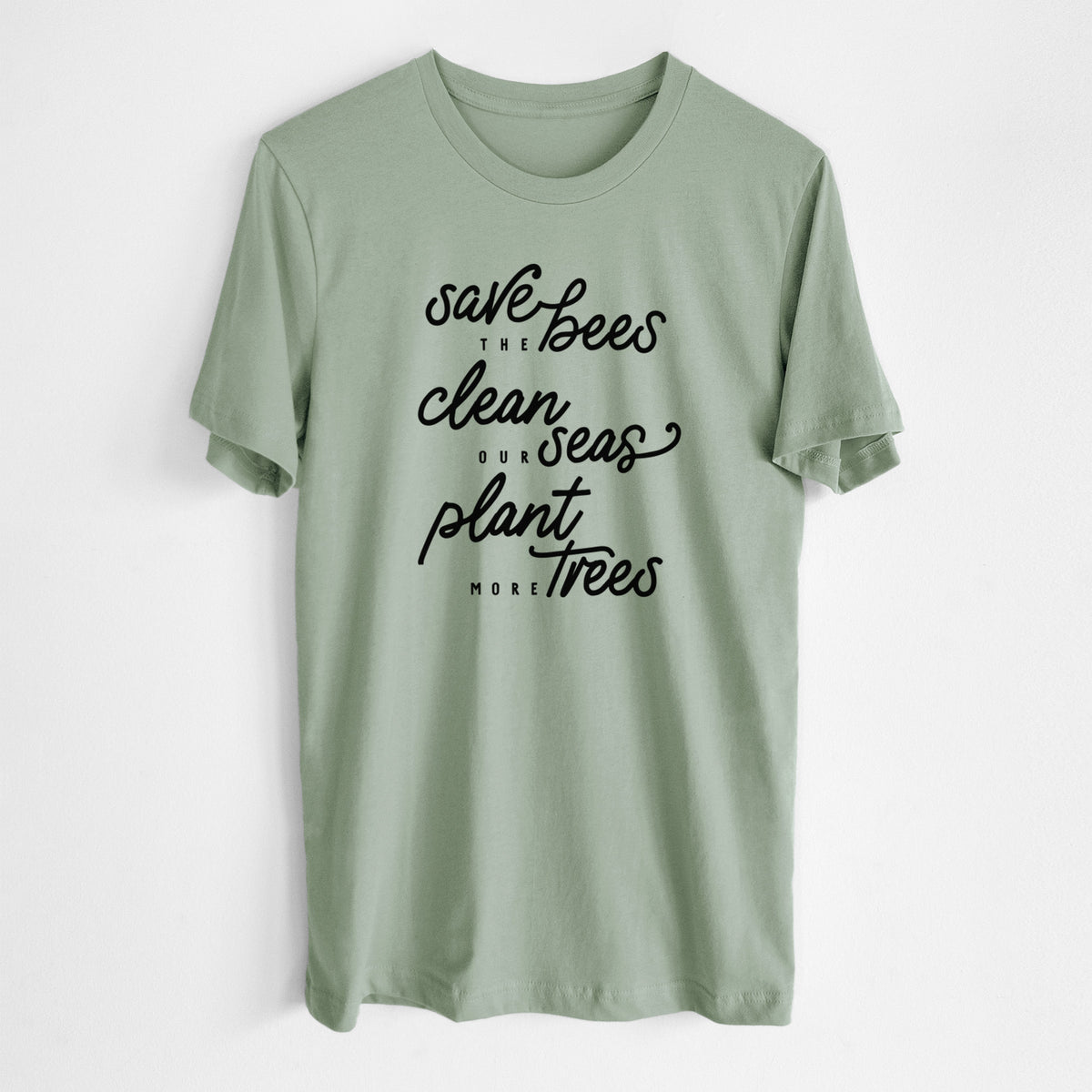 Sage green lightweight cotton t-shirt laid flat, printed with black hand-lettered words reading Save the Bees, Clean Our Seas, Plant More Trees.