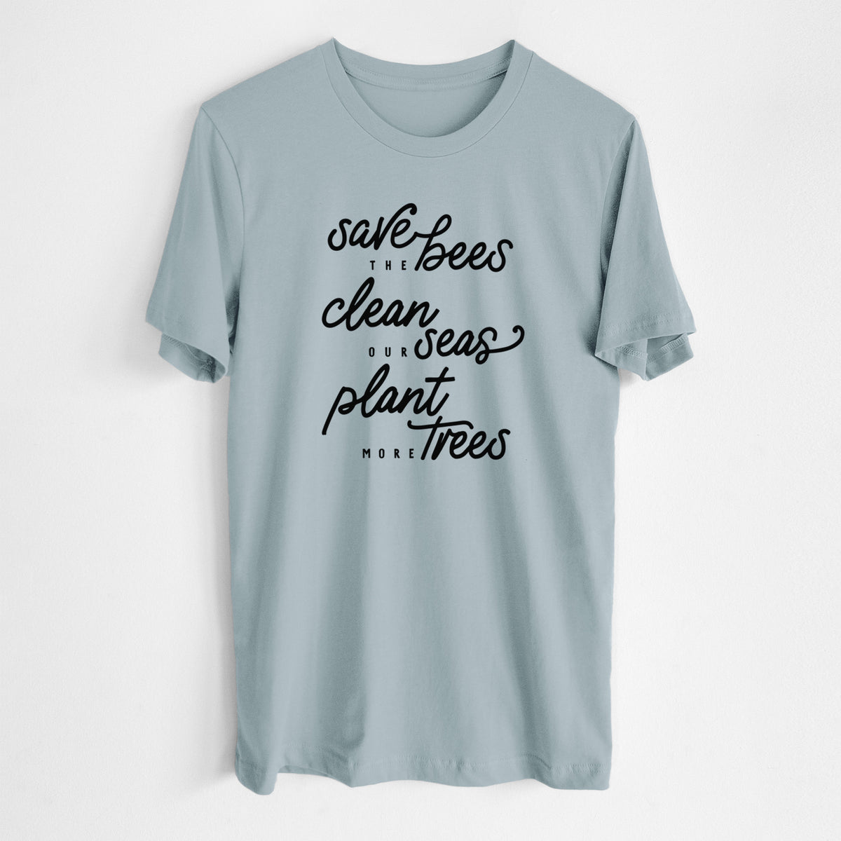 Vintage denim lightweight cotton t-shirt laid flat, printed with black hand-lettered words reading Save the Bees, Clean Our Seas, Plant More Trees.