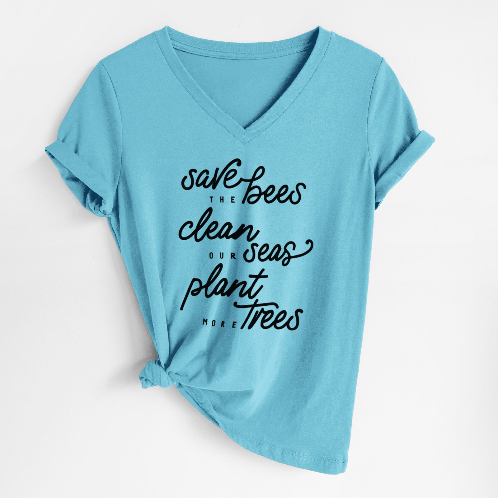 Turquoise women's relaxed fit cotton V-neck t-shirt laid flat, printed with black hand-lettered words reading Save the Bees, Clean Our Seas, Plant More Trees.