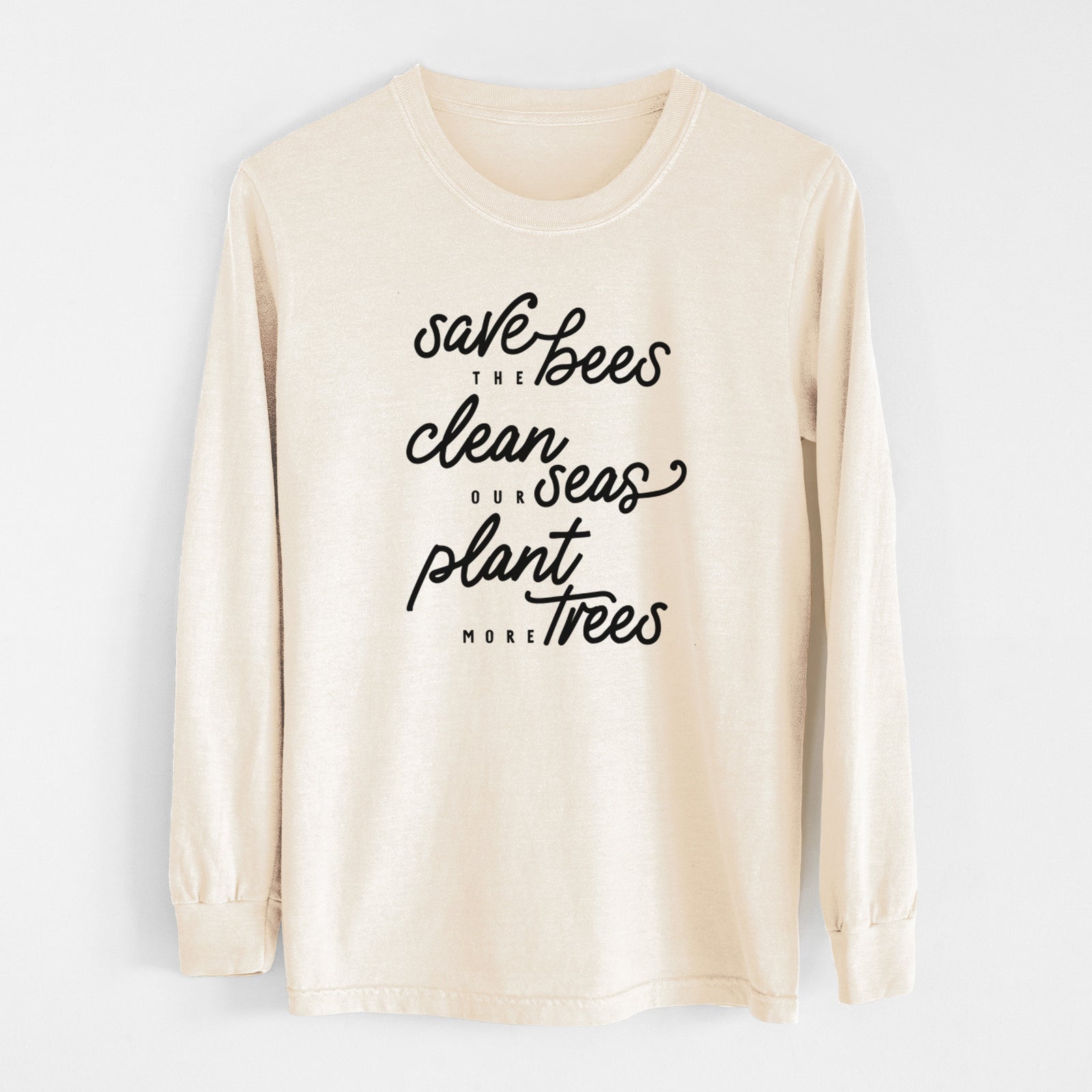 Ivory Comfort Colors long sleeve shirt laid flat, printed with black hand-lettered words reading Save the Bees, Clean Our Seas, Plant More Trees.