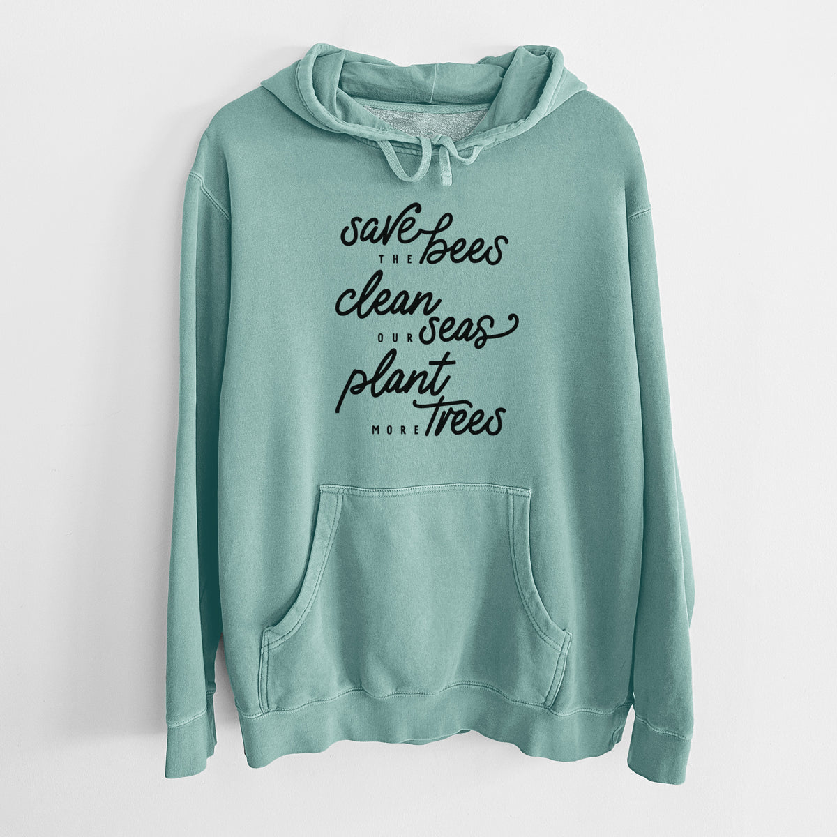 Mint green pigment dyed hoodie laid flat, printed with black hand-lettered words reading Save the Bees, Clean Our Seas, Plant More Trees.