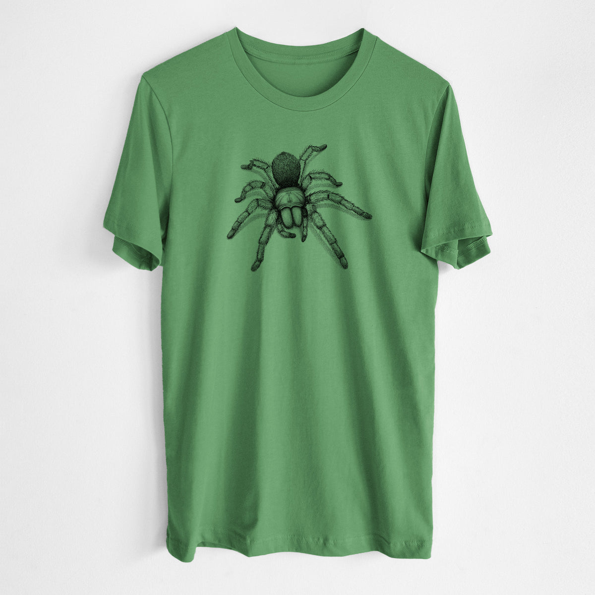 Leaf green lightweight cotton t-shirt laid flat, printed with a detailed black ink illustration of a desert blonde tarantula.