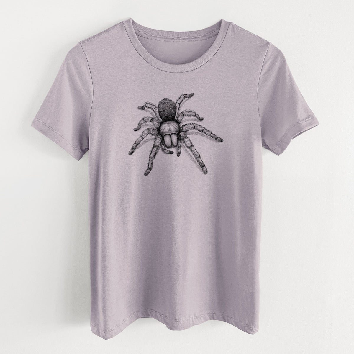 Light violet women's relaxed fit cotton t-shirt laid flat, printed with a detailed black ink illustration of a desert blonde tarantula.