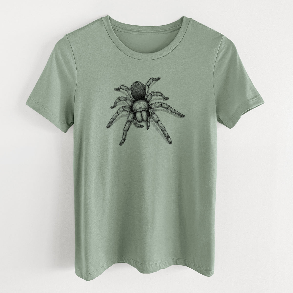 Sage green women's relaxed fit cotton t-shirt laid flat, printed with a detailed black ink illustration of a desert blonde tarantula.