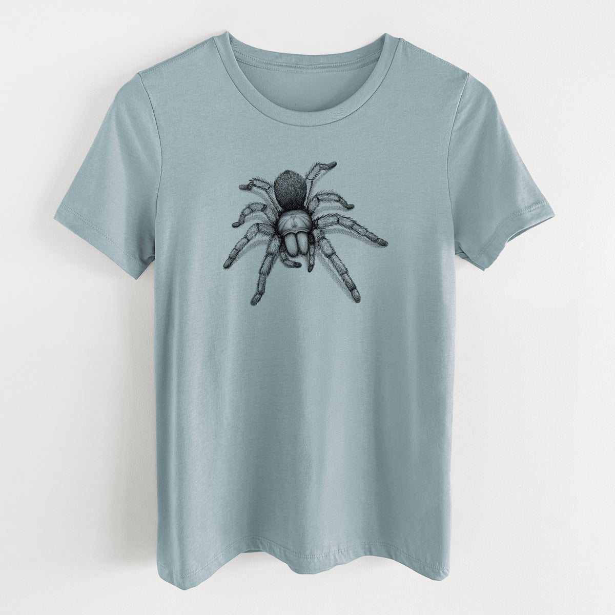 Vintage denim women's relaxed fit cotton t-shirt laid flat, printed with a detailed black ink illustration of a desert blonde tarantula.
