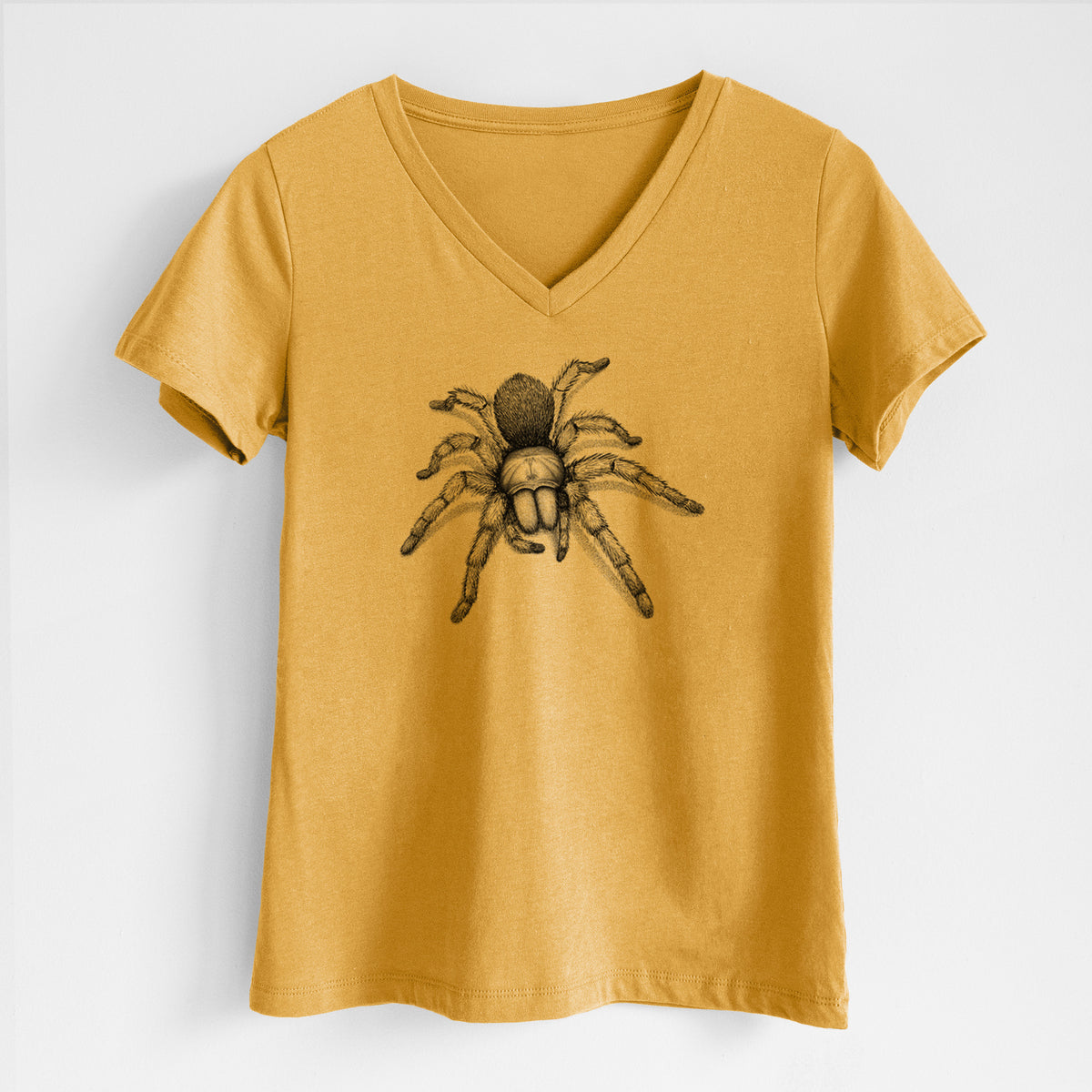 Honeycomb yellow women's relaxed fit cotton V-neck t-shirt laid flat, printed with a detailed black ink illustration of a desert blonde tarantula.