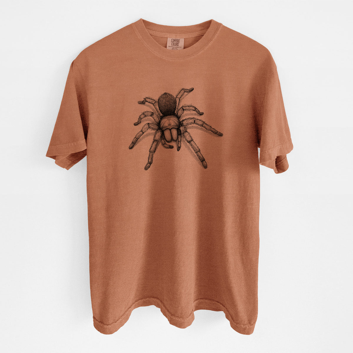 Yam burnt orange Comfort Colors t-shirt laid flat, printed with a detailed black ink illustration of a desert blonde tarantula.