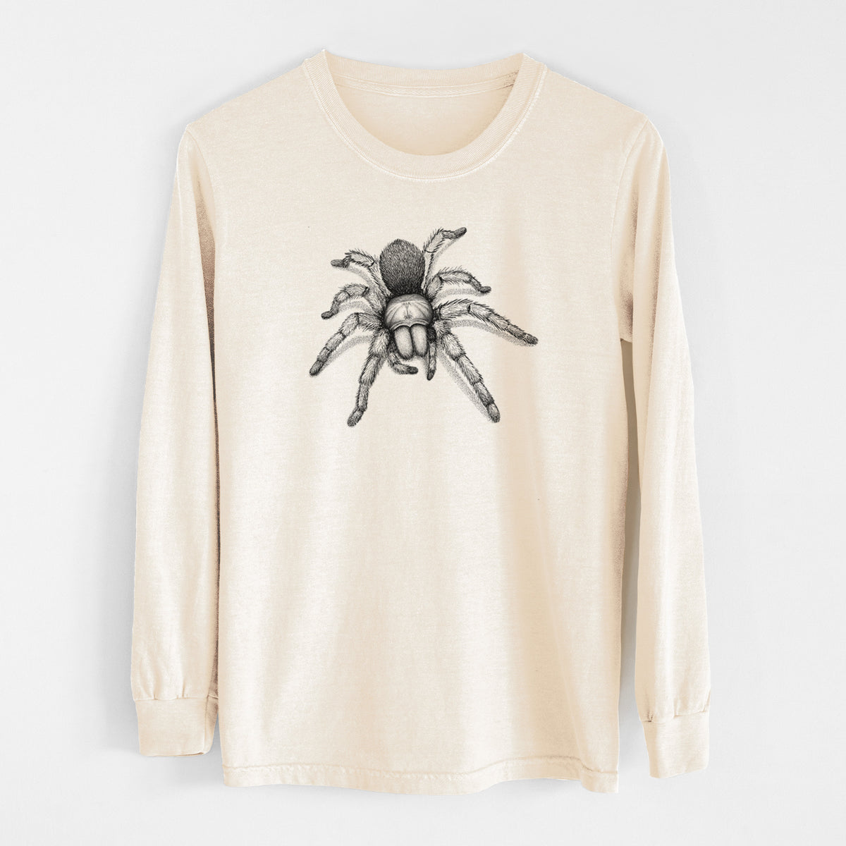 Ivory Comfort Colors long sleeve shirt laid flat, printed with a detailed black ink illustration of a desert blonde tarantula.