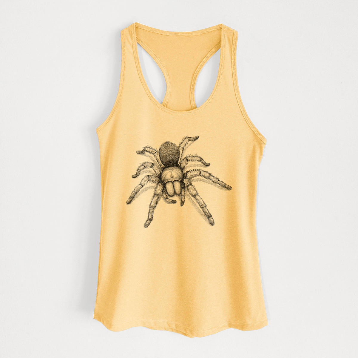 Banana cream women's racerback tank top laid flat, printed with a detailed black ink illustration of a desert blonde tarantula.