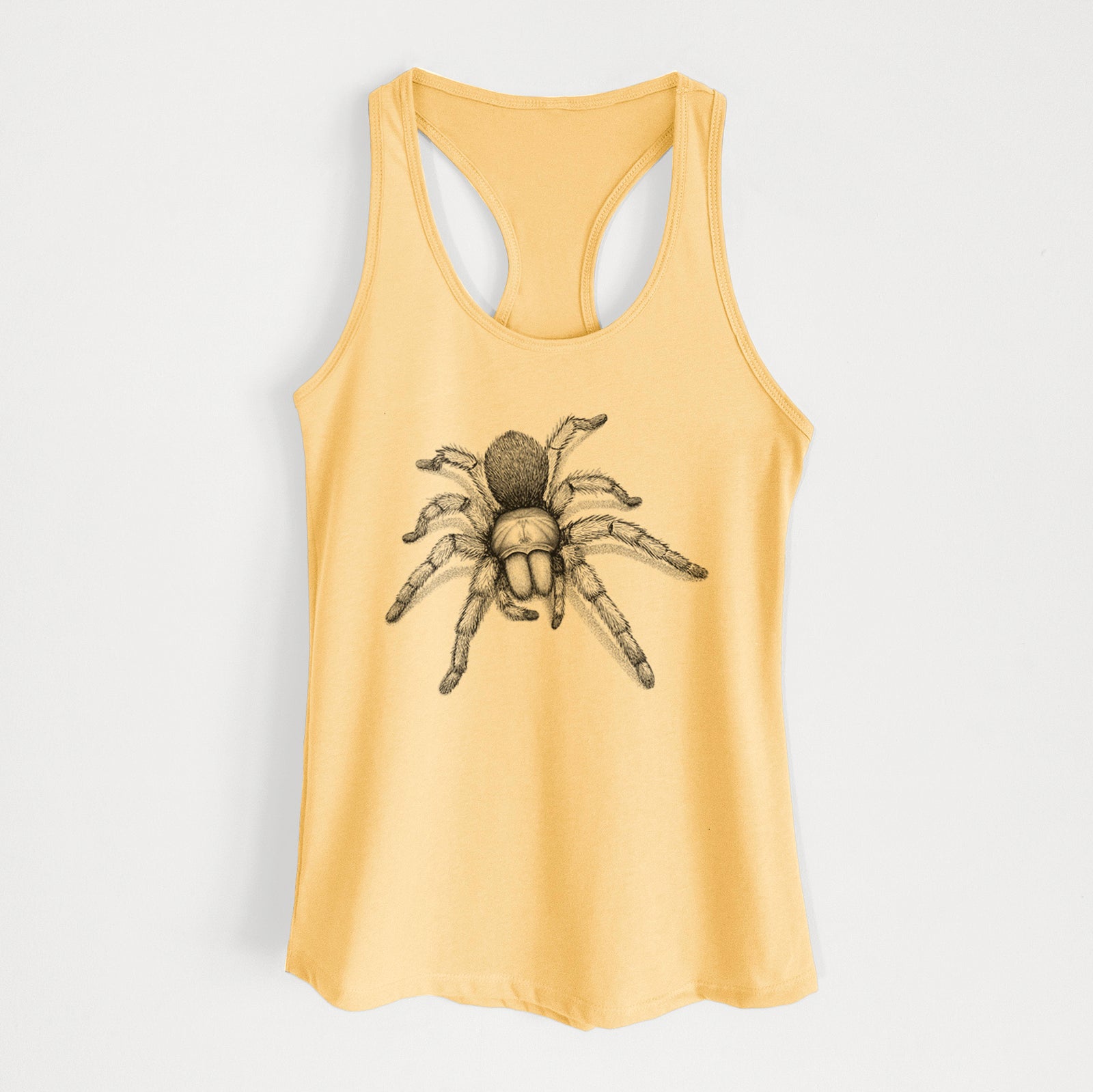 Banana cream women's racerback tank top laid flat, printed with a detailed black ink illustration of a desert blonde tarantula.