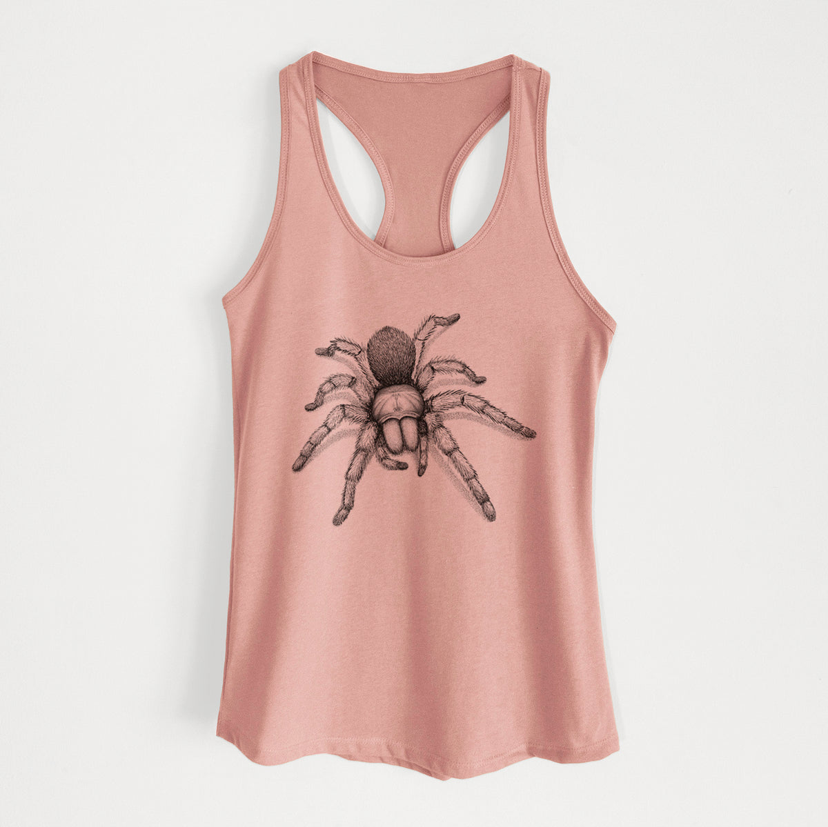 Desert pink women's racerback tank top laid flat, printed with a detailed black ink illustration of a desert blonde tarantula.