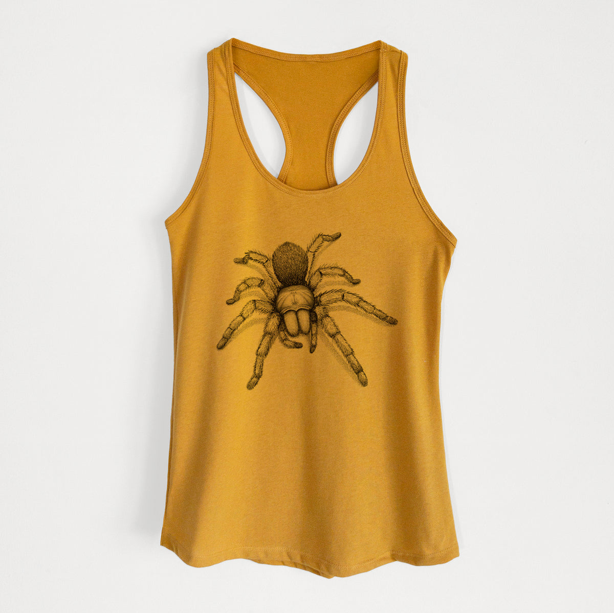 Gold women's racerback tank top laid flat, printed with a detailed black ink illustration of a desert blonde tarantula.